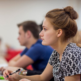 Female student in a lecture looking serious