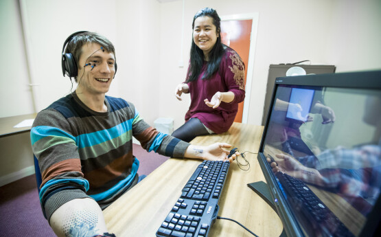 Psychology students doing an experiment at a computer.