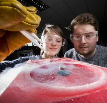 Two students running an experiment