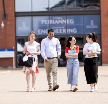 Students walking out of a building on Bay campus