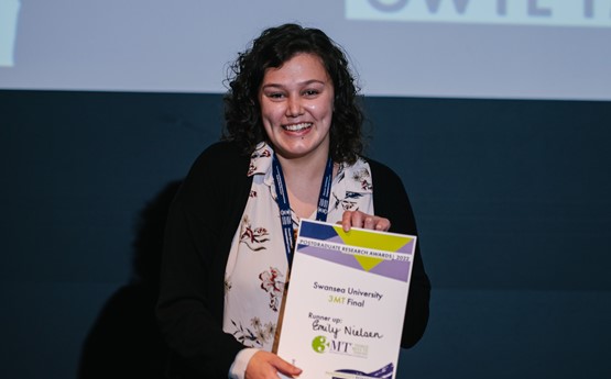 women looking happy holding certificate