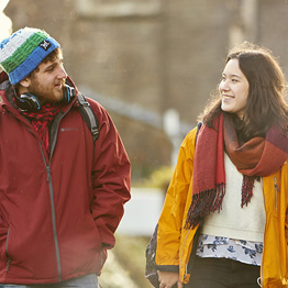 Two students walking through Singleton Park